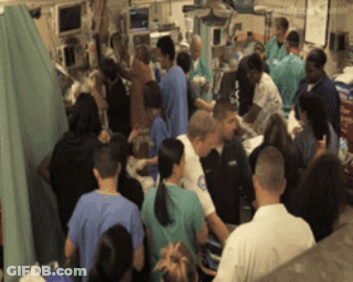 Group In Hospital Room With Police Officer GIF