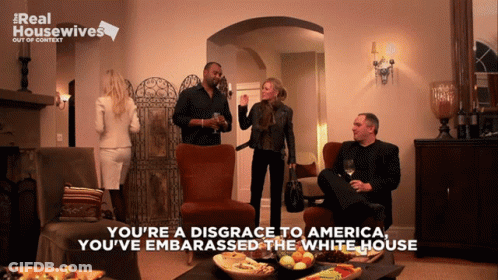 Group In Living Room Saying You're A Disgrace To America GIF
