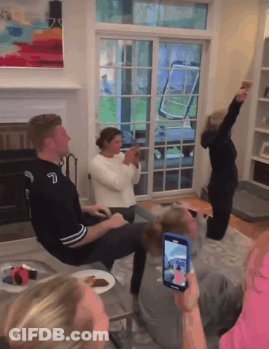 Group In Living Room With Number 7 Jersey GIF