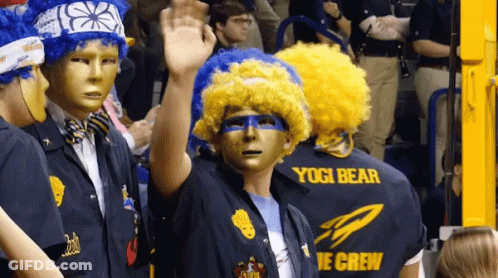 Group In Masks And Wigs Wearing Yogi Bear Shirts GIF