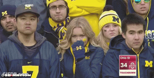Group In Michigan Jerseys Watching Game GIF