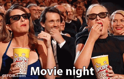 Group In Movie Theater Eating Popcorn Wearing 3D Glasses GIF