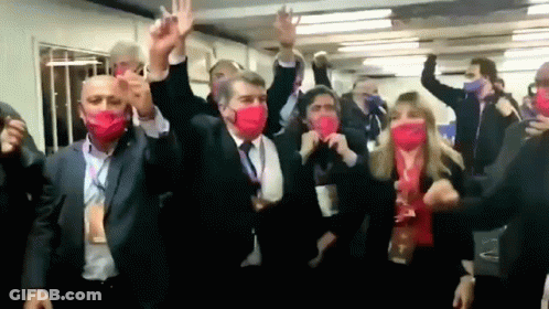 Group In Red Masks Dancing With Arms In Air GIF
