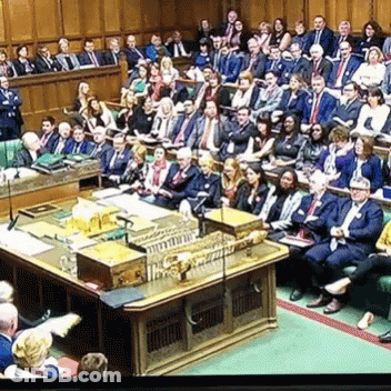 Group In Room With Parliament Podium GIF