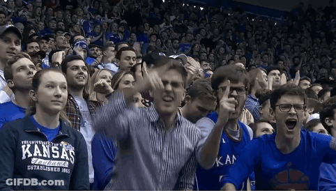 Group In Stadium Holding Head GIF
