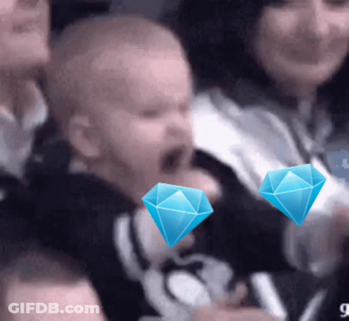 Group In Stadium With Two Blue Diamonds On Head GIF