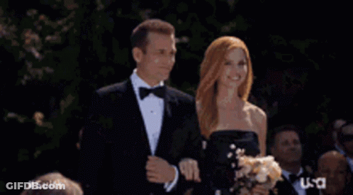 Group In Tuxedos And Bow Ties In Front Of US Sign GIF