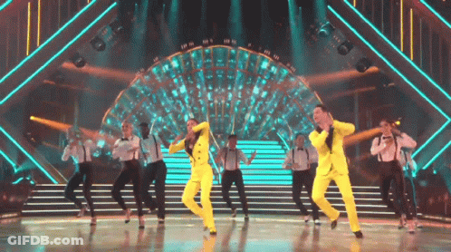 Group In Yellow Suits Dancing GIF