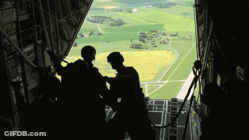 Group Looking Out Plane Window GIF
