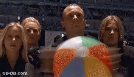 Group Looking Up At Man Holding Beach Ball GIF