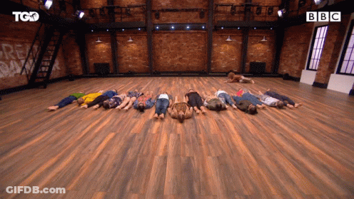 Group Lying On Backs On Wooden Floor With BBC GIF