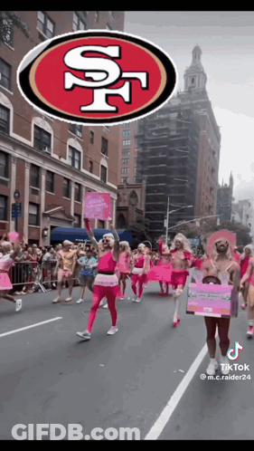 Group Marching Down Street With San Francisco 49Ers Logo GIF