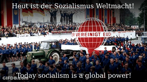 Group Marching In Front Of Vereinigt Euc Sign GIF