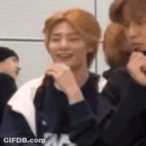 Group Member Smiling And Covering Mouth GIF
