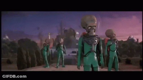 Group Of Aliens Standing On A Planet GIF
