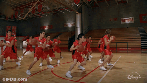 Group Of Basketball Players In Red Uniforms With Number 23 GIF
