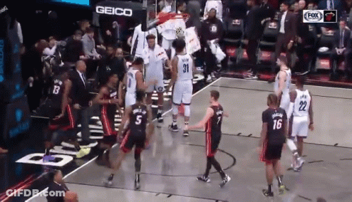 Group Of Basketball Players On Court With Geico Sign GIF