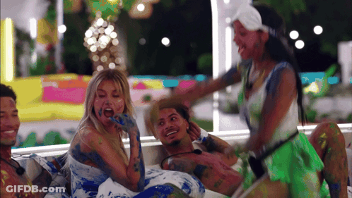 Group Of Blue-Painted People One Eating GIF