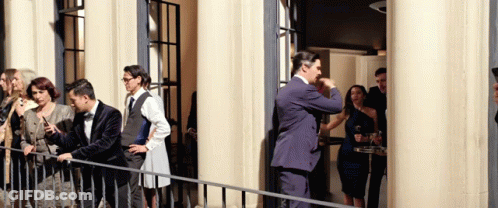 Group Of Cats Standing In A Row With Paws Up GIF