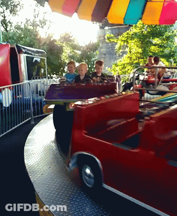 Group Of Children On Red Carnival Ride GIF