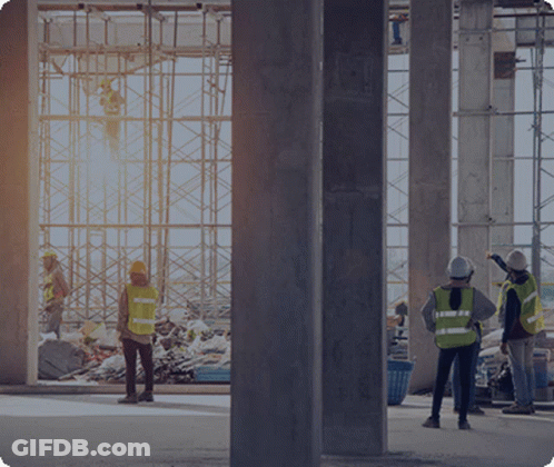 Group Of Construction Workers In Front Of Large Window GIF