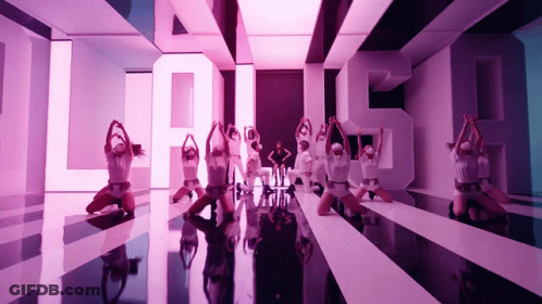 Group Of Dancers Performing In Front Of Large S GIF