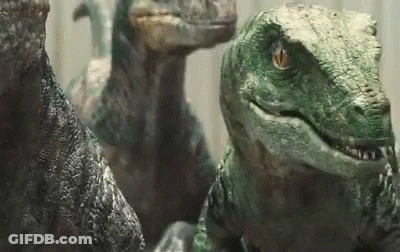 Group Of Dinosaurs Looking At Camera GIF