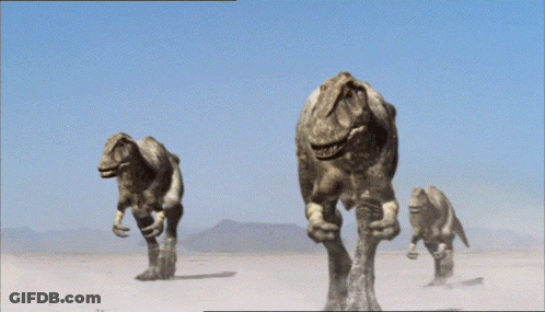 Group Of Dinosaurs Walking Through Desert GIF