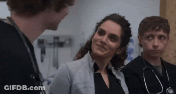 Group Of Doctors Talking In Room GIF