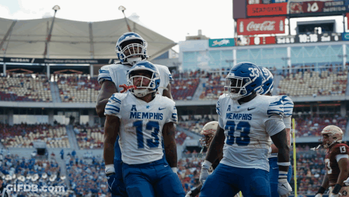 Group Of Football Players In Memphis Jerseys GIF