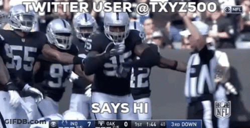 Group Of Football Players Standing On Field GIF