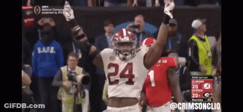 Group Of Football Players Standing On Field GIF