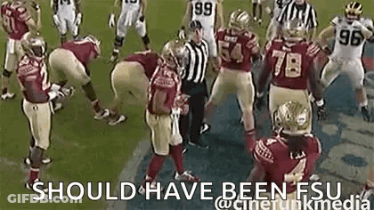 Group Of Football Players With Referee On Field GIF
