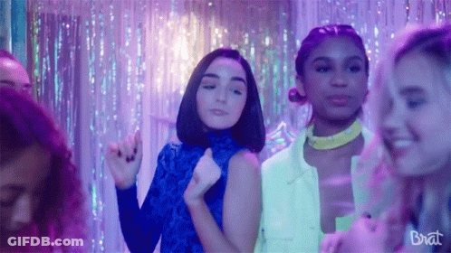 Group Of Girls Dancing In Room With Purple Lights And Brat GIF