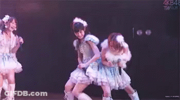Group Of Girls Dancing On Stage With Microphones GIF