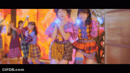 Group Of Girls In Colorful Dresses Dancing GIF