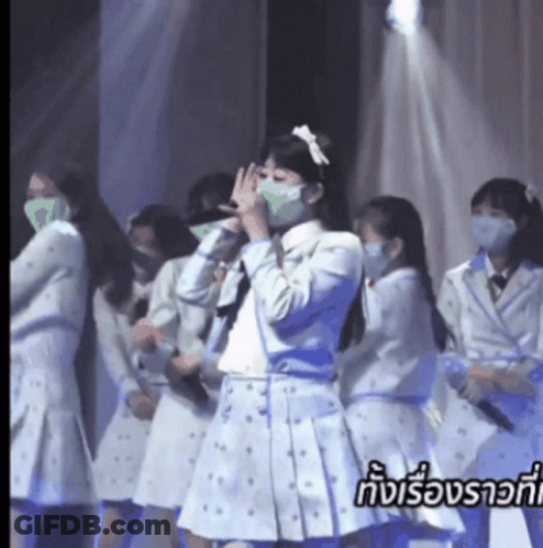 Group Of Girls In Face Masks On Stage GIF