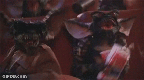 Group Of Gremlins Standing Together GIF
