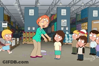 Group Of Kids Standing Around Woman In Warehouse GIF