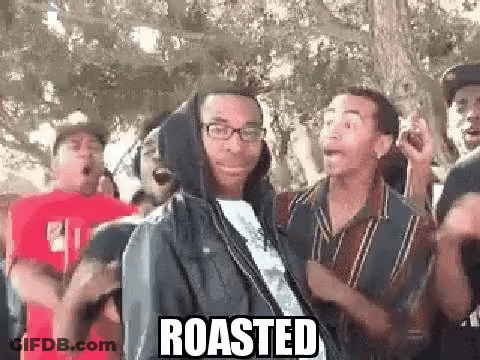 Group Of Men Around Hooded Man With Glasses GIF