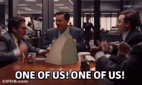 Group Of Men Around Table With One Holding Paper Saying One Of Us GIF