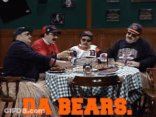 Group Of Men At Table Saying Da Bears GIF