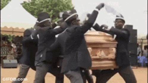 Group Of Men Dancing Around Coffin GIF