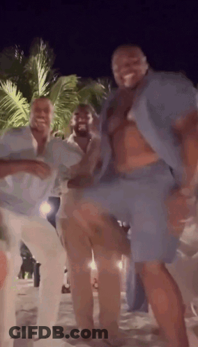Group Of Men Dancing On Beach At Night GIF