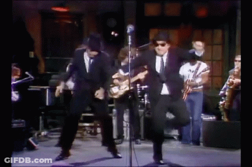 Group Of Men Dancing On Stage GIF