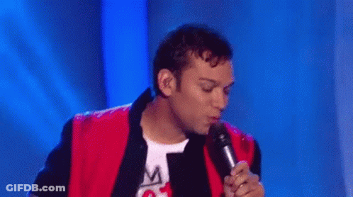 Group Of Men Dancing On Stage With Microphone GIF