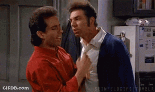 Group Of Men Dancing On Street In Front Of Building GIF