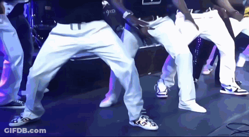 Group Of Men Dancing With 9X0 Shirt GIF