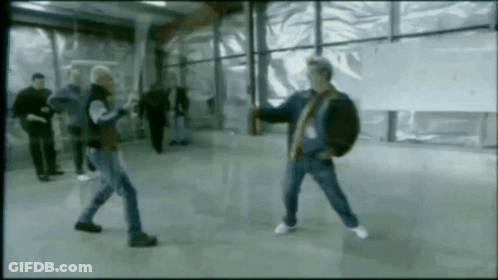 Group Of Men Fighting In Room GIF