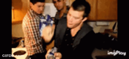 Group Of Men Holding Bottles In Kitchen GIF